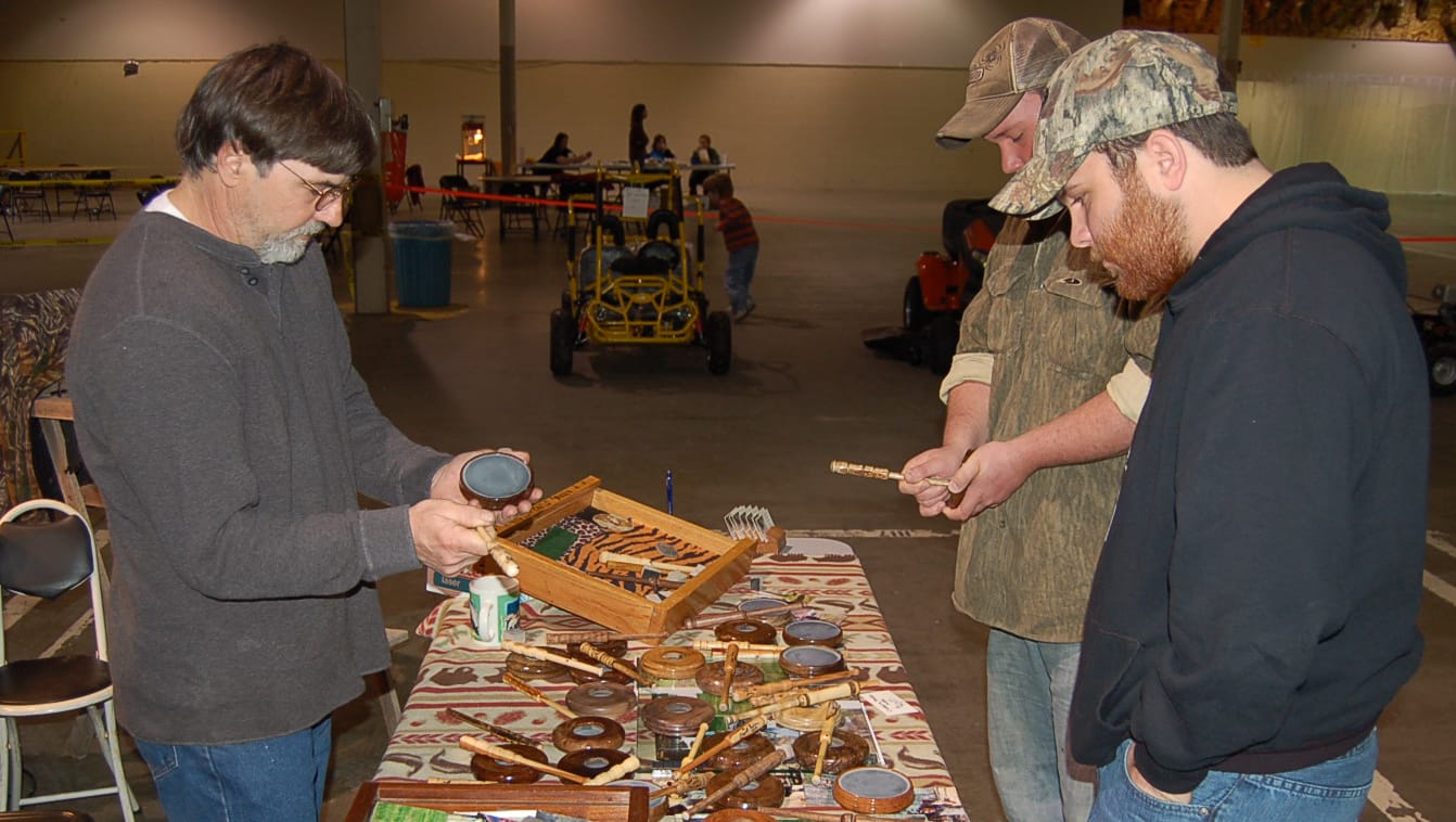 Darrell Parker demonstrating turkey calls at a craft show
